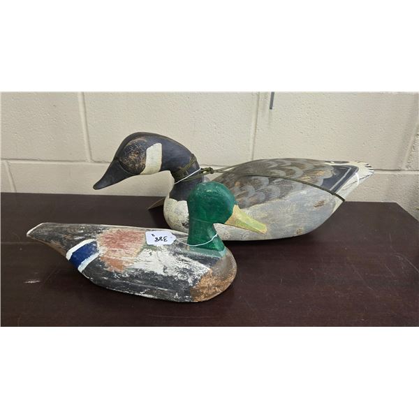 Two duck decoys including Ducks Unlimited Canada Goose classic edition decoy 1 of 500 by carver M. M
