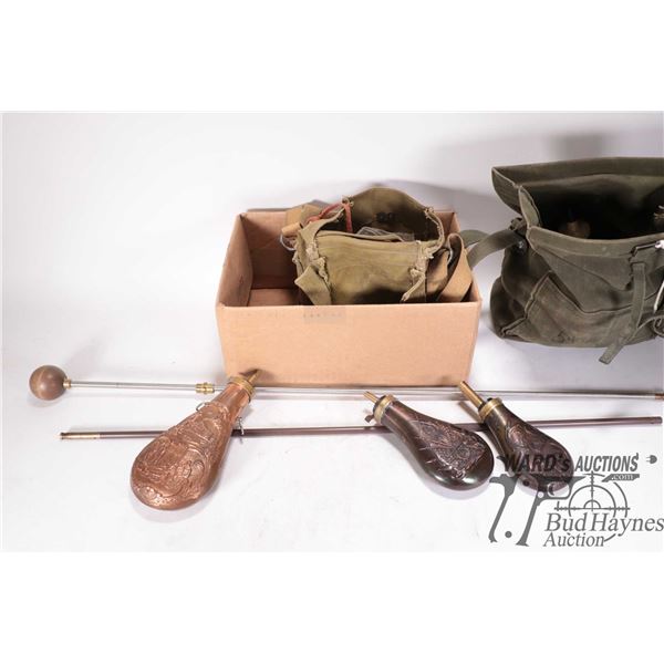 Three powder casks and an assortment of black powder accessories including .45 cal balls, .50 cal ba