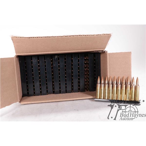 Two hundred fifty rounds of 5.56mm ball ammo. on ten round plastic clips