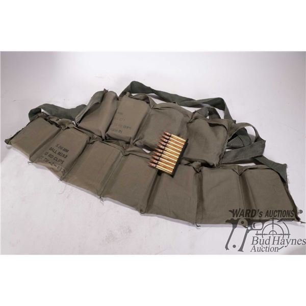 Two ammo. pouches with approximately 250 rounds of 5.56 ball ammo.