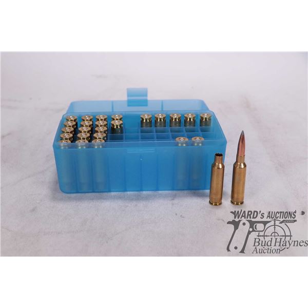 Small ammo. box with one 6.5 Creedmore reload and 25 primed brass