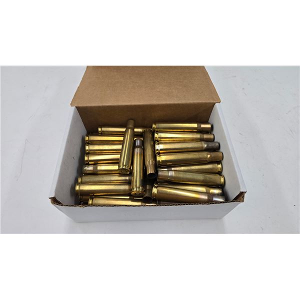 Lot containing approximately 60 used .50 cal brass