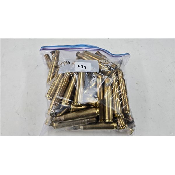Lot containing approximately 60 used .50 cal brass