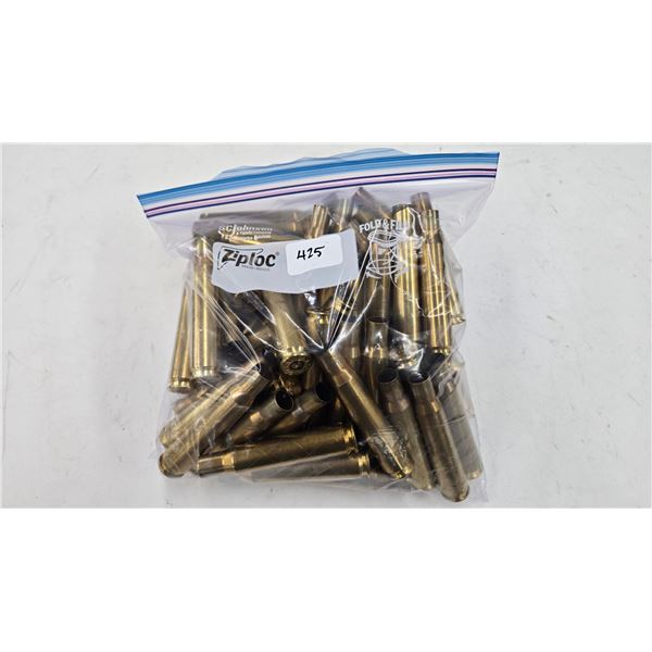 Lot containing approximately 60 used .50 cal brass