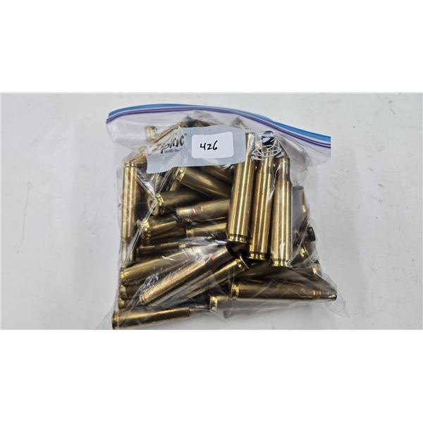 Lot containing approximately 60 used .50 cal brass