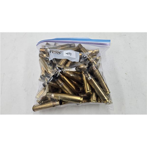Lot containing approximately 60 used .50 cal brass