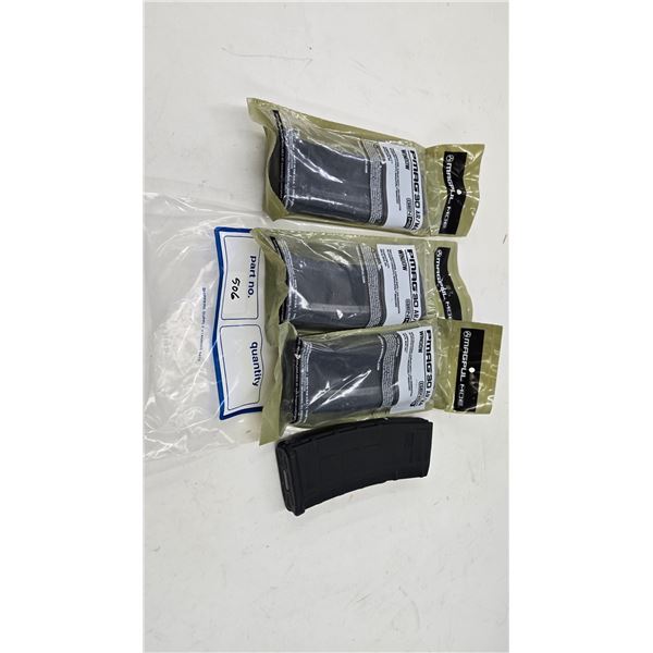 Three new in package Magpul PMag 30 AR/M4 Gen M2 mags and one used