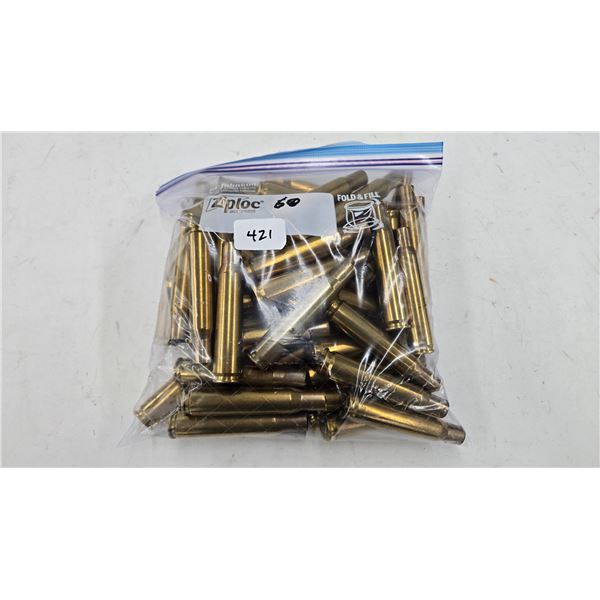 Lot containing approximately 60 used .50 cal brass