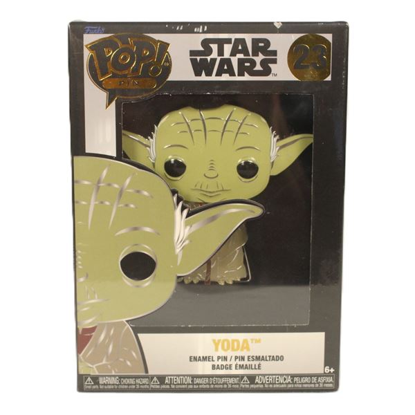 A large Funko Pop Pin Yoda #23 Enamel Pin.