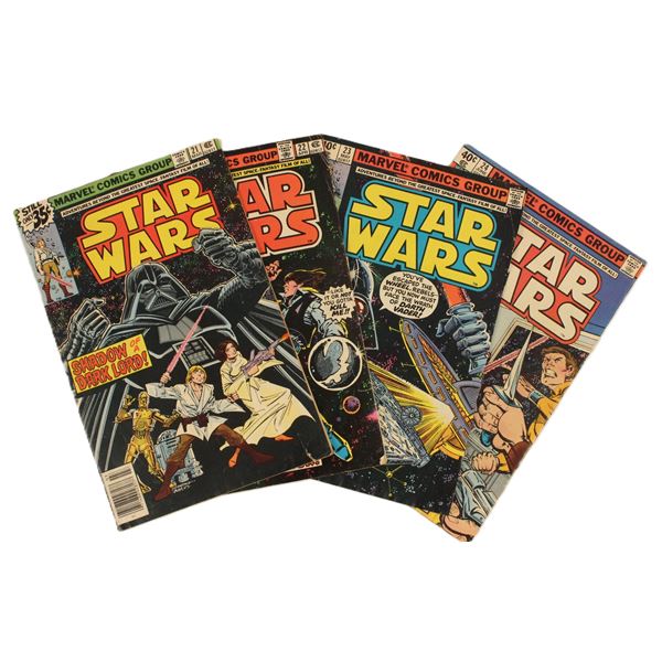 A set of (4) Vintage Marvel Star Wars Comics.
