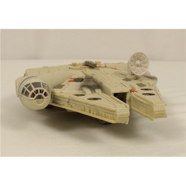 A MicroMachines Star Wars Action Fleet Millenium Falcon Toy.
