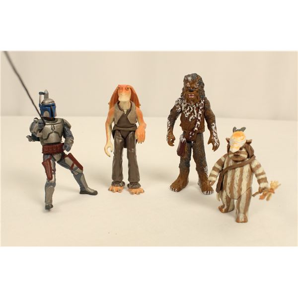 A Set Of (4) Star Wars Action Figures.
