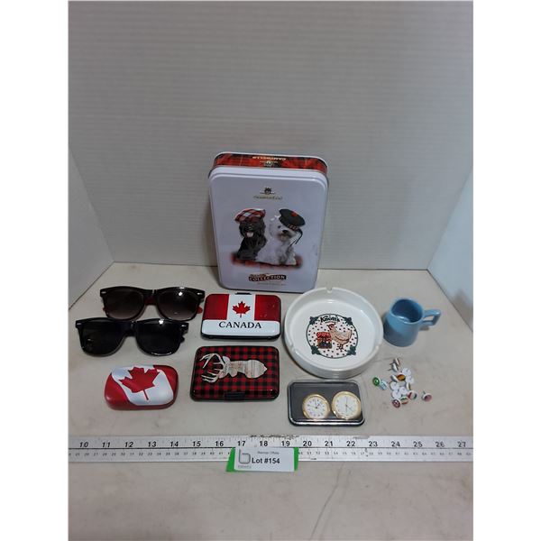 Sunglasses, Scottish Tin, Knott's Berry Farm Ash Tray, Canada Metal Wallets, Flag Pins. Misc.
