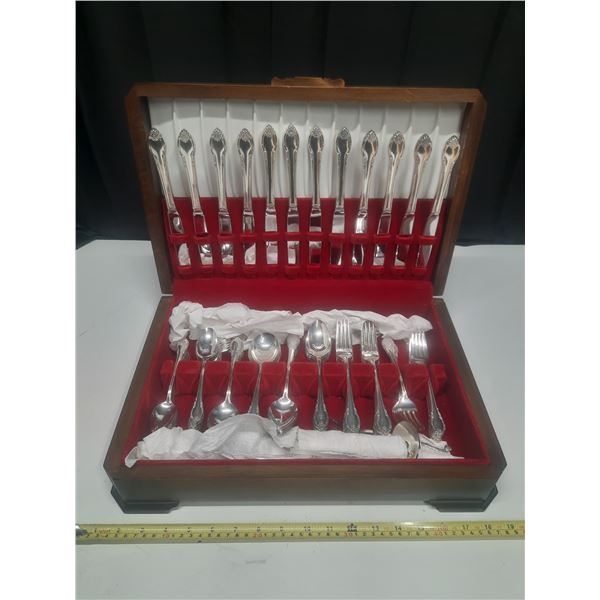 Roger’s silver-plated full set cutlery in a wooden case.