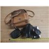Image 1 : Vintage film camera kit, including a camera body with a lens attached.