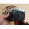 Image 2 : Vintage film camera kit, including a camera body with a lens attached.