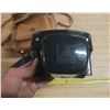 Image 5 : Vintage film camera kit, including a camera body with a lens attached.
