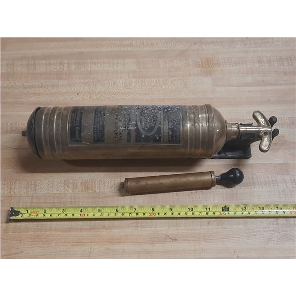 Antique brass fire extinguisher manufactured by the Pyrene Company.