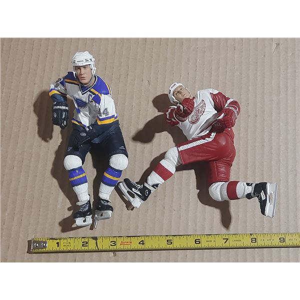 Action figures of professional hockey players, Chris Pronger wearing a St. Louis Blues jersey and Br