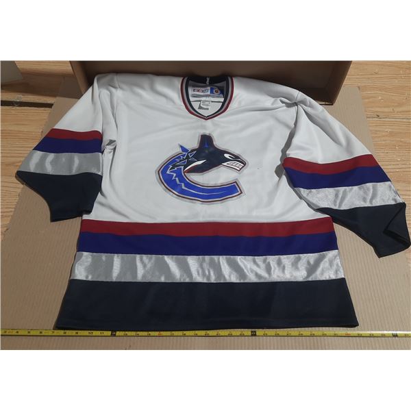 Vintage Vancouver Canucks CCM jersey features the iconic white "Orca" logo. Size - Adult XL.