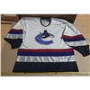 Image 1 : Vintage Vancouver Canucks CCM jersey features the iconic white "Orca" logo. Size - Adult XL.