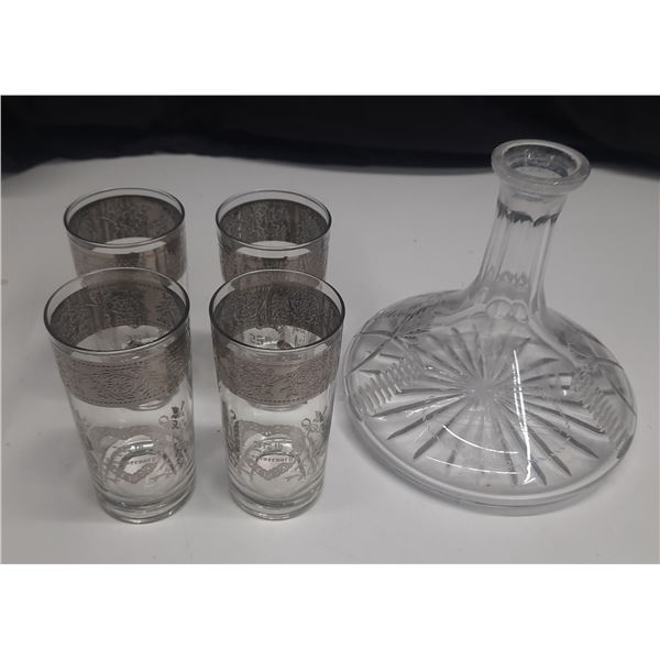 Vintage crystal drink set, featuring a ships decanter with a wide base and four drinking glasses ado