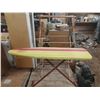 Image 2 : Vintage folding ironing board with a striped cover (Height 35"), positioned in front of a wooden dry