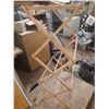 Image 5 : Vintage folding ironing board with a striped cover (Height 35"), positioned in front of a wooden dry