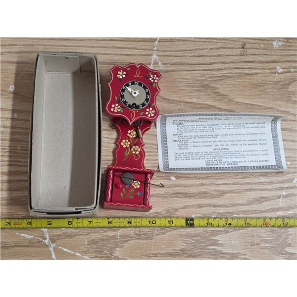Miniature grandfather clock- wind up- has key- 8"H