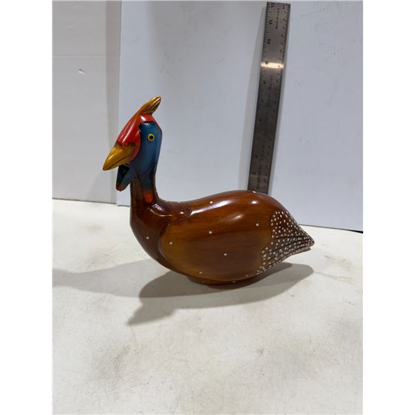 hand-painted and carved wooden sculpture of a Crowned Guinea Fowl.
