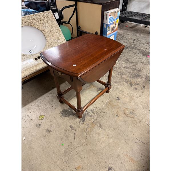 Drop side table with drawer