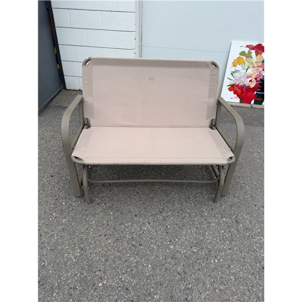 Glider rocker loveseat has rip in seat