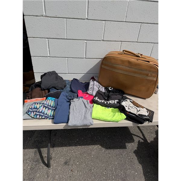 Assorted clothing and suitcase