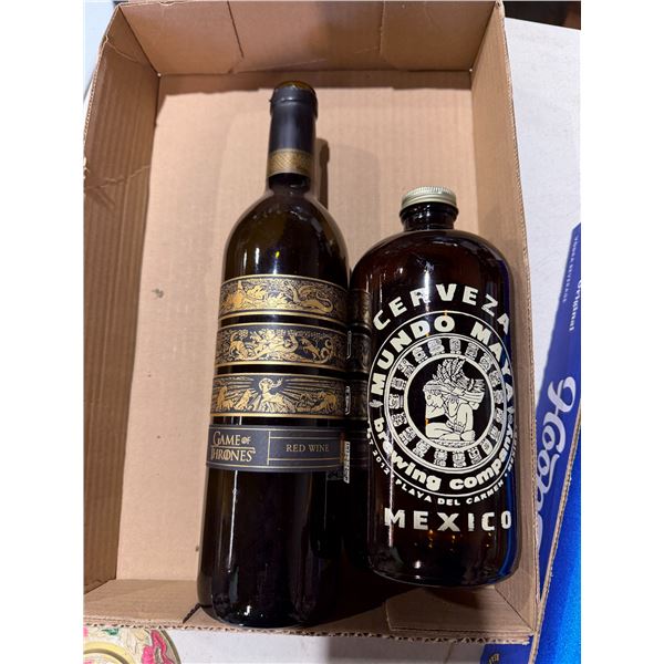 Collectible Game of Thrones, red wine bottle, and Mexico bottle both empty