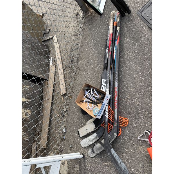 Hockey sticks and skate guards, etc.