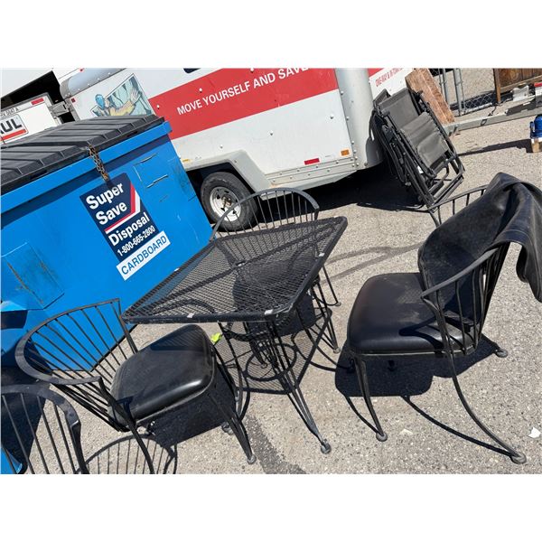 Table with three chairs and table cover