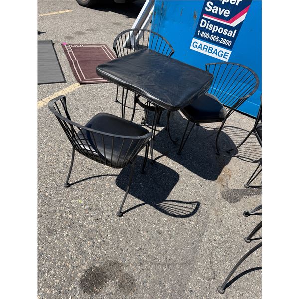 Patio table with cover and three chair chairs