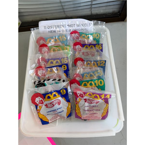 11. Different hot wheels, new and original packages from happy meals.