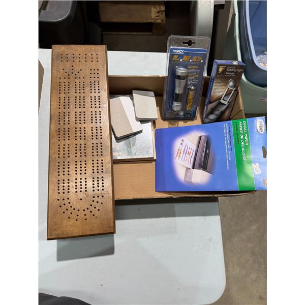 Crib, board deck, paper, flashlight, etc.
