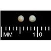 Image 1 : Lot of two tiny natural pearls with original Fisher certificates, 0.07 carat each, both Grade 1B, ex