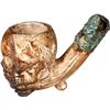 Image 1 : Ornate, skull-shaped clay pipe with cuprous stem, 1600s-1700s.