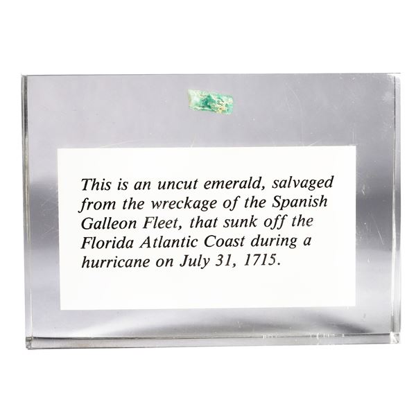 Small natural emerald in Lucite block, ex-1715 Fleet.
