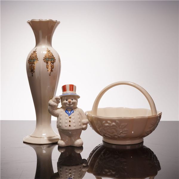 Three Lenox Ivory Porcelain Pieces including Catalan Bud Vase, Floral Basket, and Patriotic Snowman