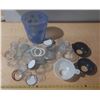 Image 1 : Vintage canning jar components, including glass lids, rubber rings, and a patterned plastic containe
