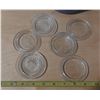 Image 5 : Vintage canning jar components, including glass lids, rubber rings, and a patterned plastic containe