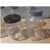 Image 5 : Collection of vintage glass canning jars, commonly known as Mason jars, housed within a black plasti