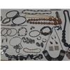 Image 11 : Vintage costume jewelry, including a variety of bracelets, earrings, and necklaces.