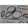 Image 4 : Vintage costume jewelry, including a variety of bracelets, earrings, and necklaces.