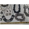Image 7 : Vintage costume jewelry, including a variety of bracelets, earrings, and necklaces.