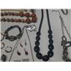 Image 8 : Vintage costume jewelry, including a variety of bracelets, earrings, and necklaces.